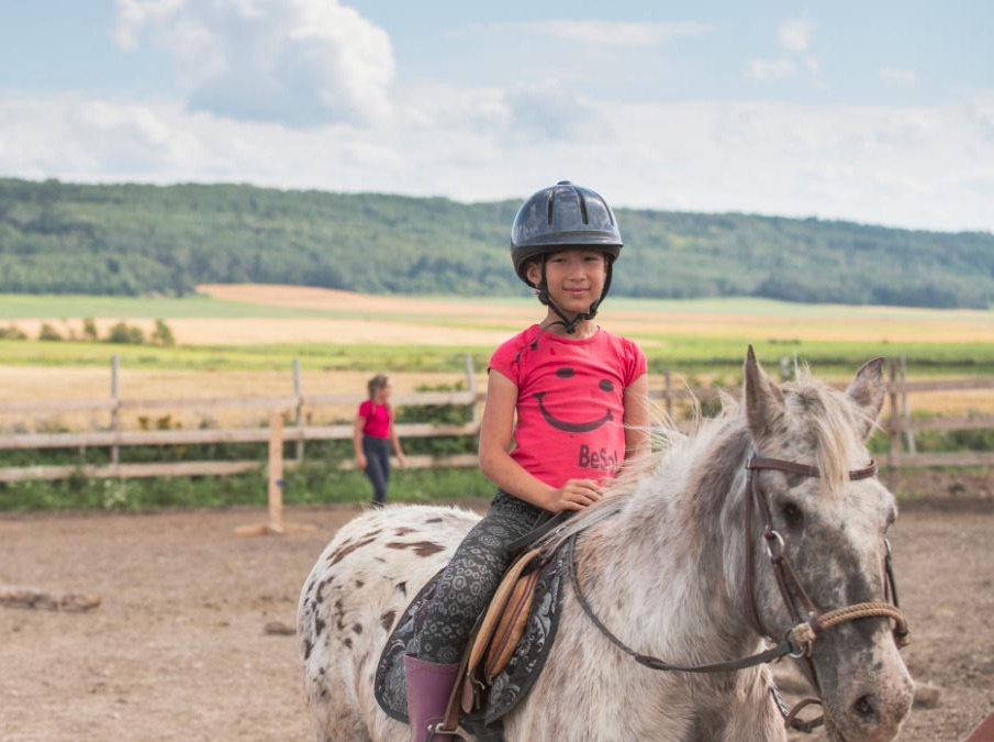 Girl on a horse in Les Basques, RCM of the Bas-Saint-Laurent region